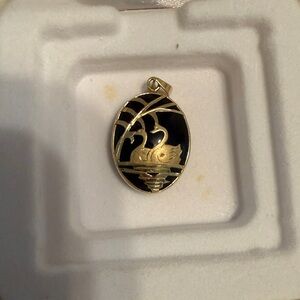 14 Karat And Black Onyx Pendant